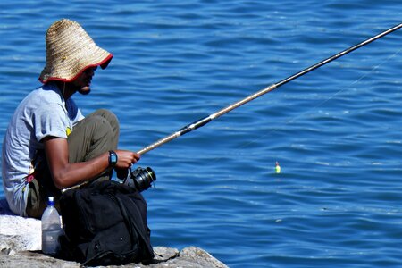 Fishing rod catch fish man photo
