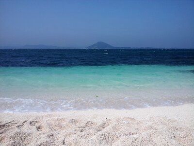 White sandy beach sea jeju island photo