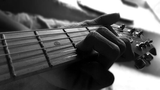 Playing music gray guitar photo
