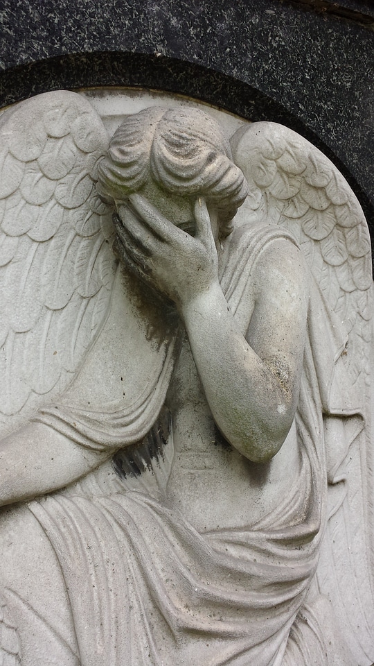 Cemetery stone statue