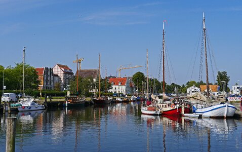 Sailing ships mirroring water photo