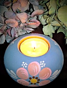 Candle holder made of wood painted blue pink white photo