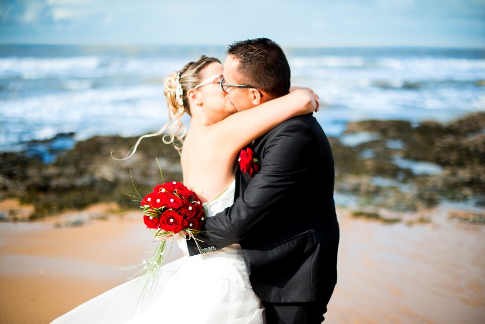 Young woman bride and groom bouquet photo