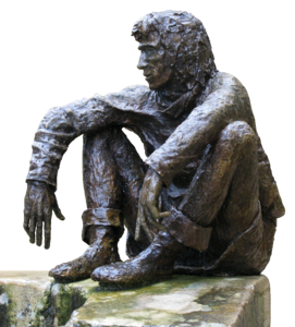 Sitting wall bronze figure