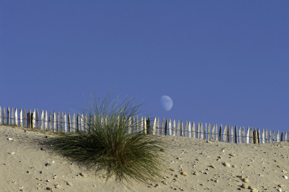 Sand closing blue sky