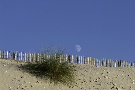 Sand closing blue sky