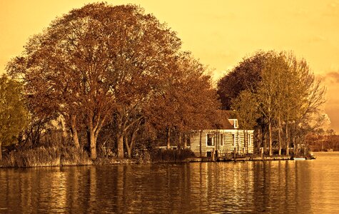 Riverbank dutch farmhouse house on the river photo