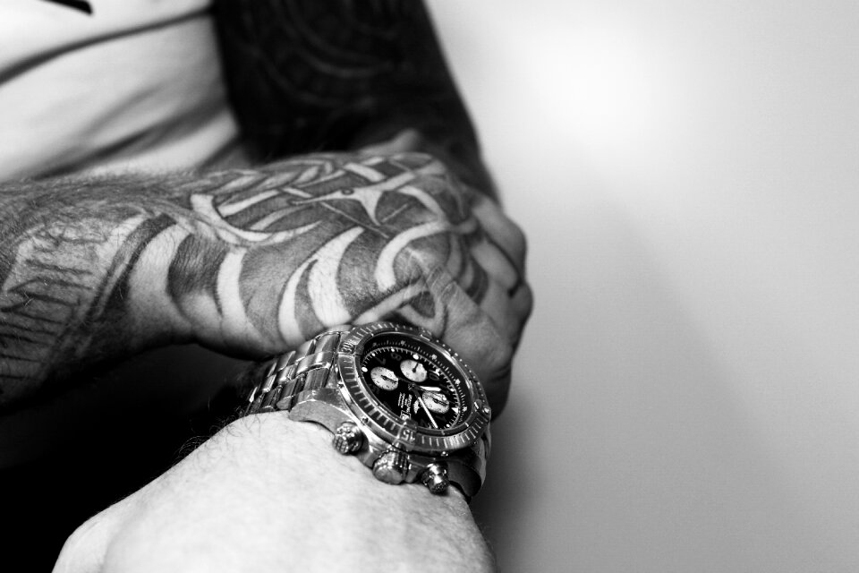 Clock black and white arm