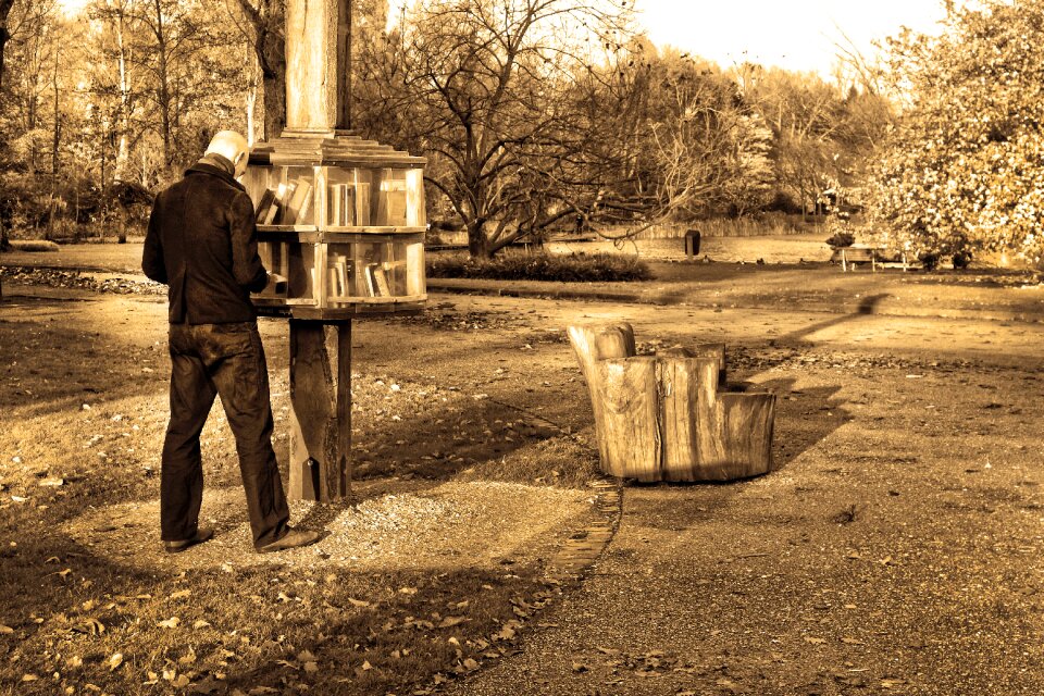 Reading book man standing