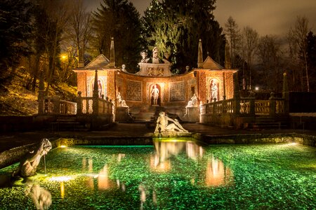 Stone figure pond night lighting