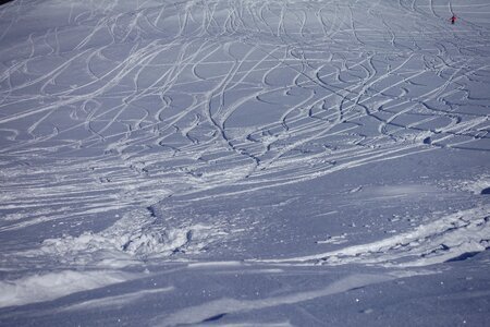 Ski tracks departure deep snow descent photo