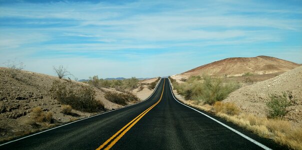 Jaunt sky desert road photo