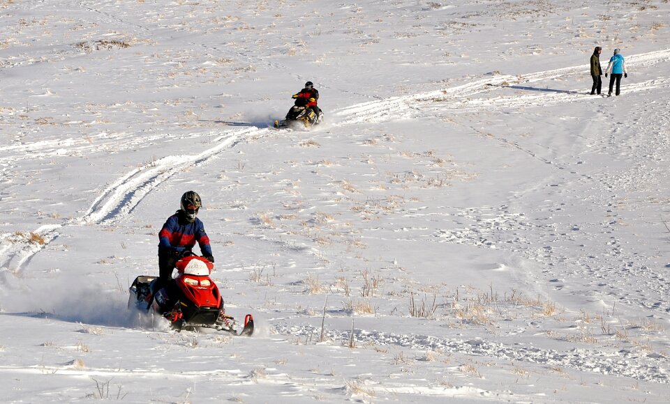 Action snowmobile mountains