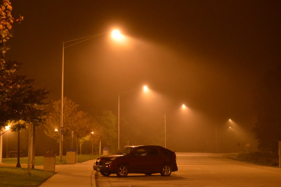 In the dark street lights dawn
