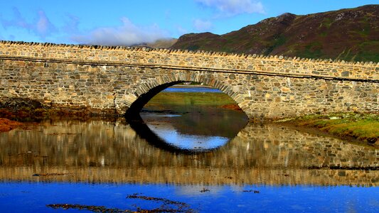 Reflection sky stone bridge photo