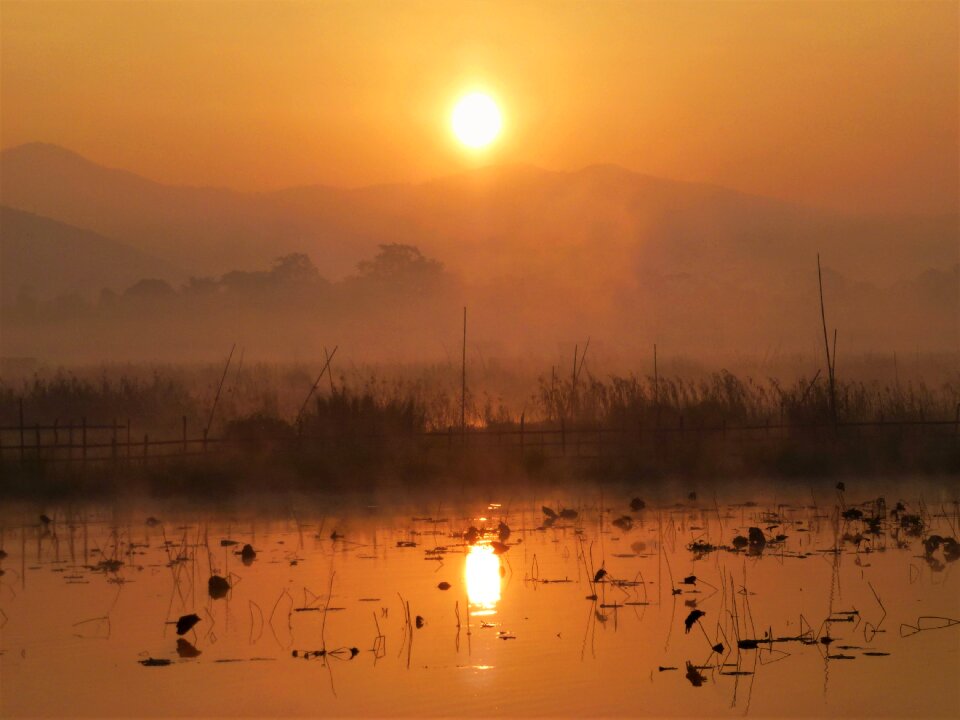 Body of water reflection sun