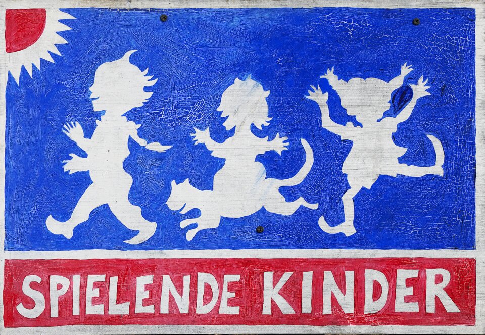 Children playing old sign weathered