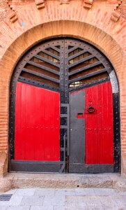 Wood gate red doors photo