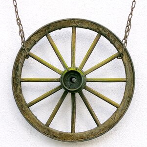 Wooden wheel suspended antique photo