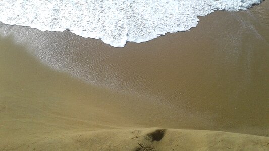Sand water waves photo