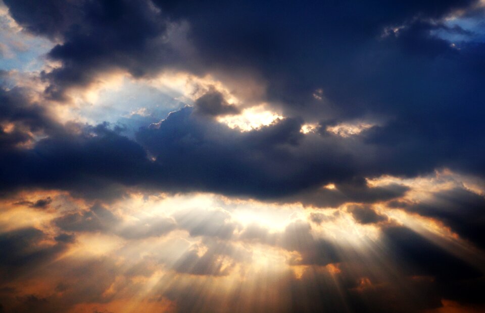 Sky the sun piercing clouds clouds cover the sun