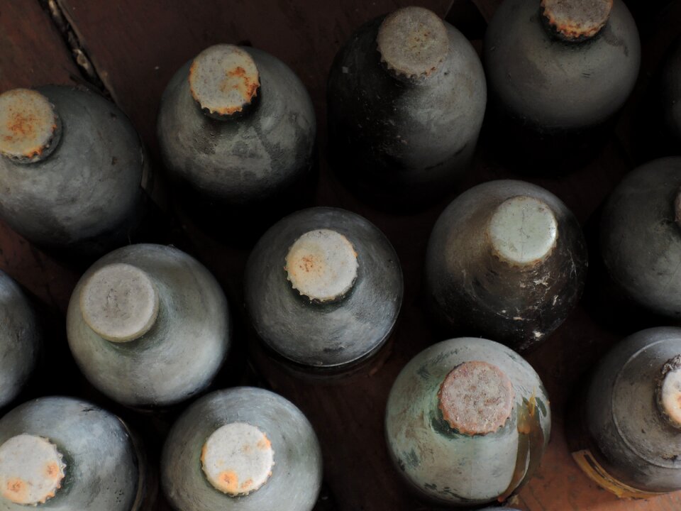 Dirty rusty glass bottle