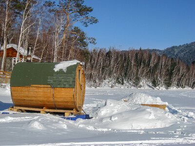 Sauna frozen lake snow photo