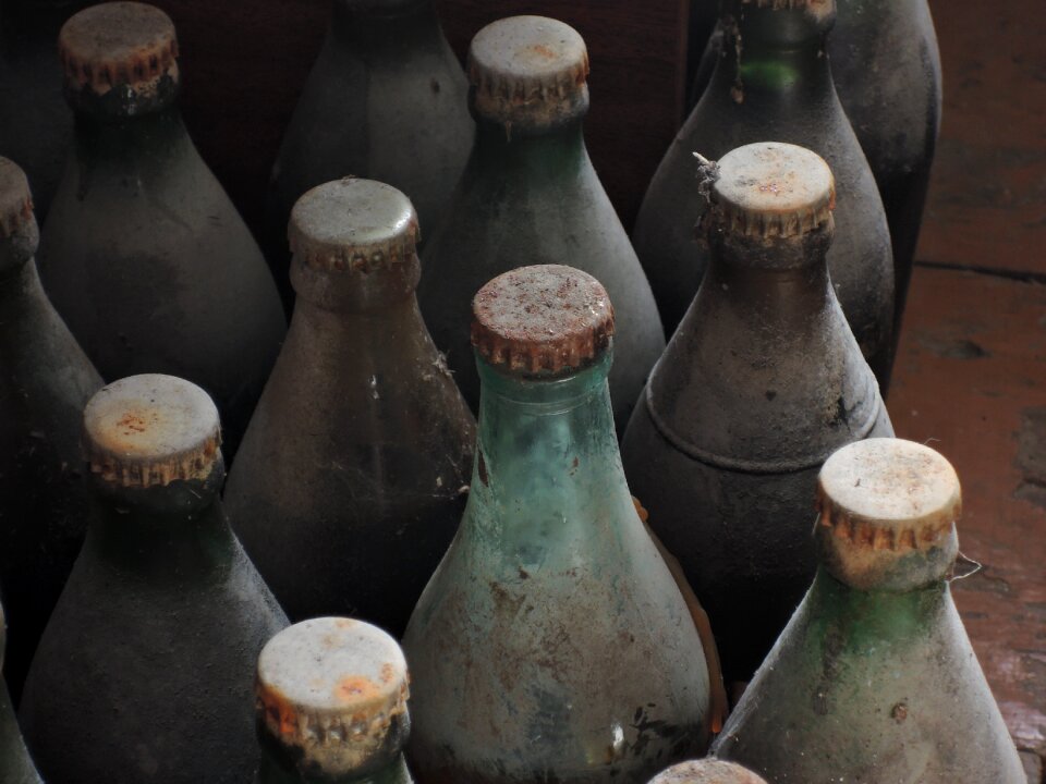 Dirty rusty glass bottle