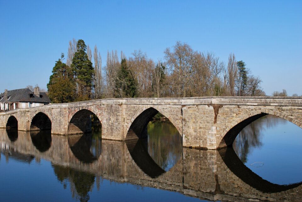 Bridge body of water reflection