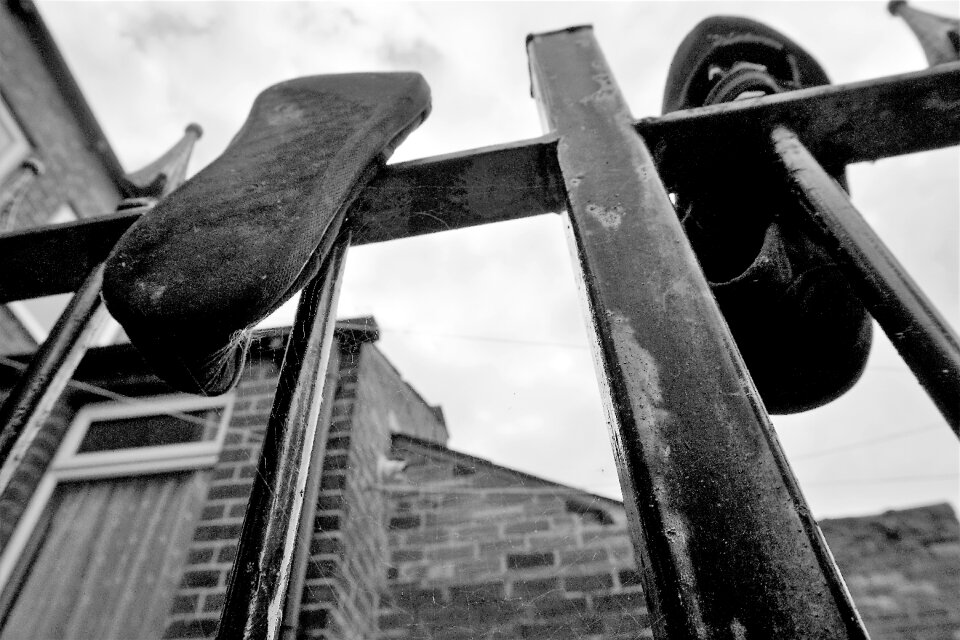 Shoes building iron fence