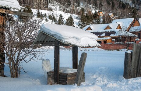 Winter landscape wooden houses village photo