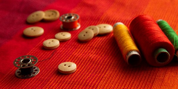 Stitching button bobbin