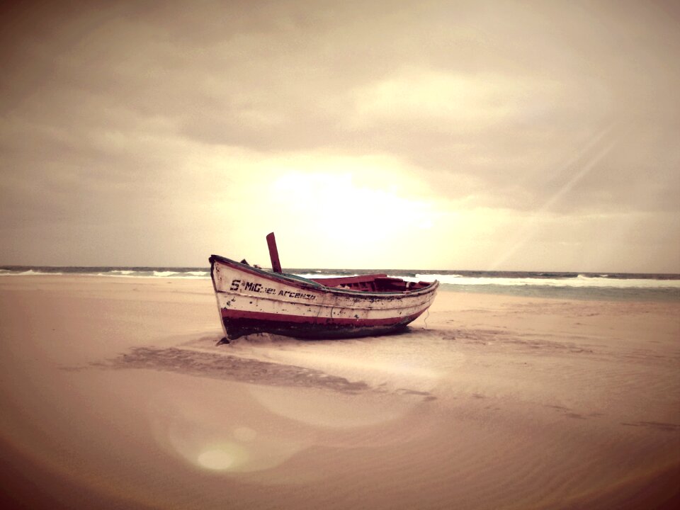 Beach boat sunset