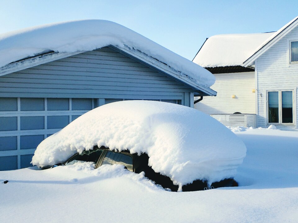 House ice car covered in snow