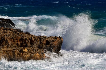 Wave crushing splashing photo