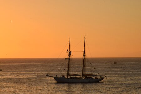 Ocean sunset sailing boat