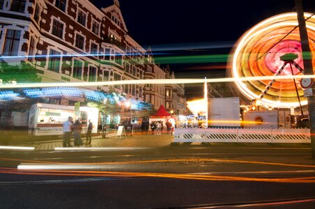 Illuminated city ferris wheel photo