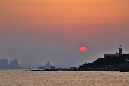 Dawn lighthouse sun