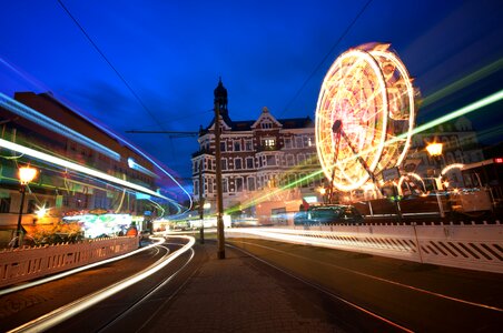 Illuminated city ferris wheel photo