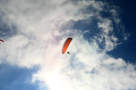 Parachute clouds jumping photo