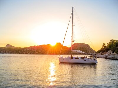 Boat sunset coast photo