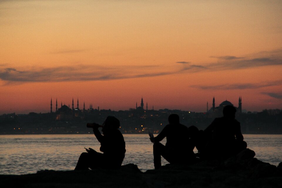 Silhouette backlit body of water