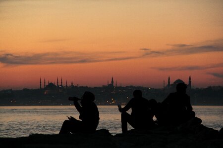 Silhouette backlit body of water