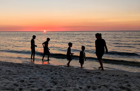 Sunset people silhouetted