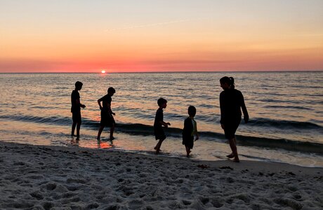 Sunset people silhouetted photo