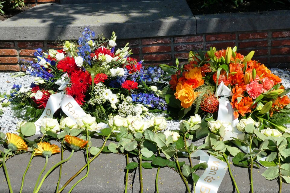 Wreath laying flower arrangement roses