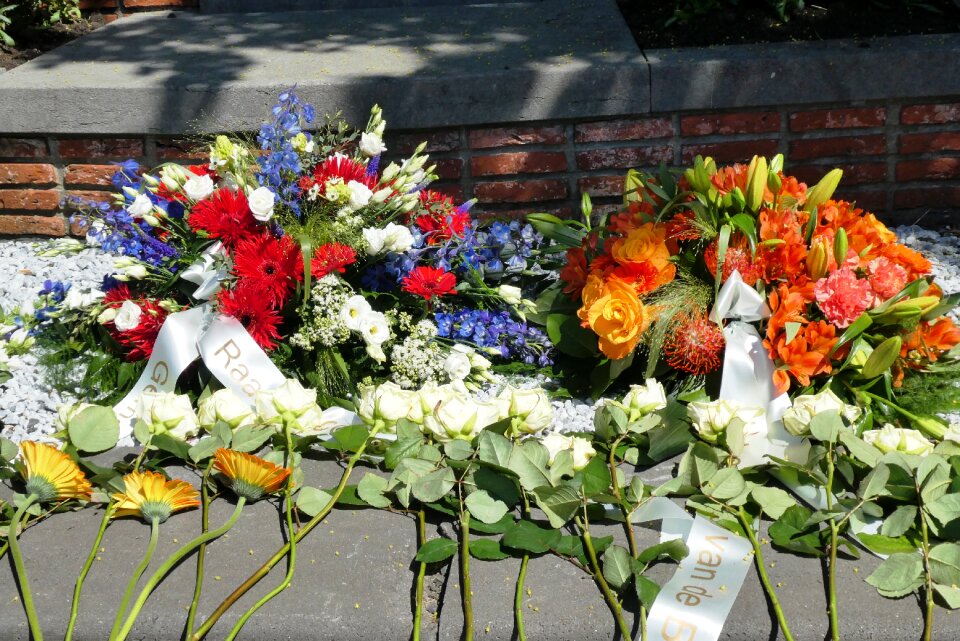 Wreath laying flower arrangement roses photo