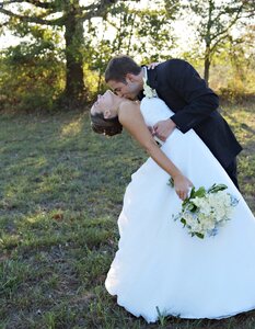 Kissing couple wedding dress photo