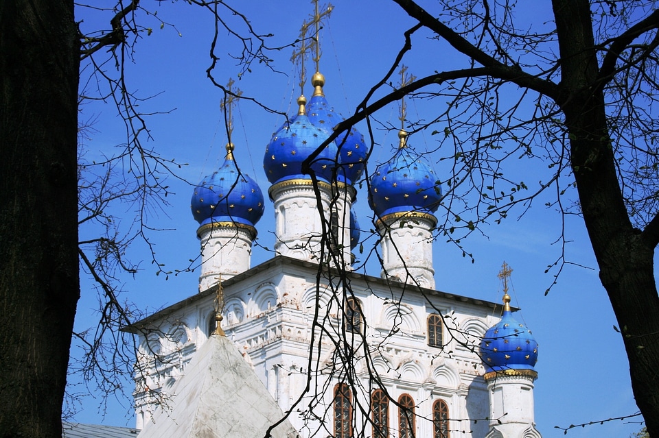 6 white towers bright blue domes building