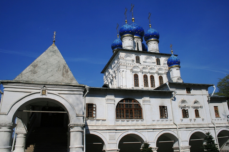 White walls white towers bright blue domes
